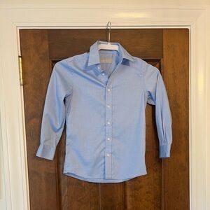 Nordstrom‘s Boys size 7 button-down light blue dress shirt.